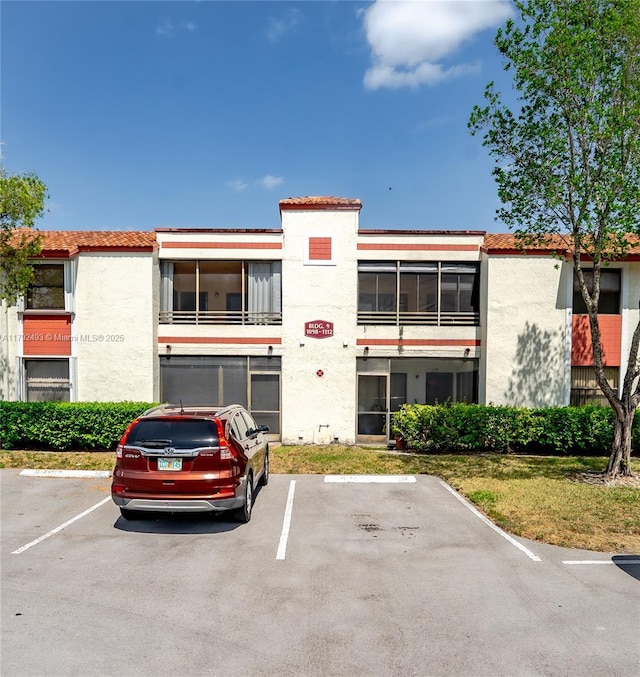 1100 N Hiatus Rd Unit 1100, Pembroke Pines, FL 33026 - view of property with uncovered parking