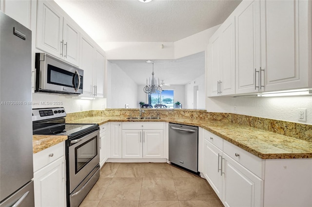 7715 Southampton Ter Unit 110, Tamarac, FL 33321 - kitchen with white cabinets, stainless steel appliances, a notable chandelier, and a sink