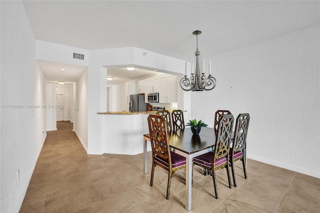 7715 Southampton Ter Unit 110, Tamarac, FL 33321 - dining room featuring baseboards, visible vents, and a chandelier
