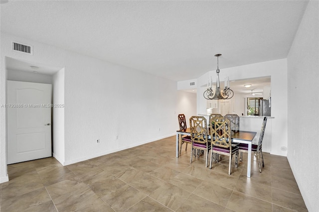 7715 Southampton Ter Unit 110, Tamarac, FL 33321 - dining area with visible vents, baseboards, and a notable chandelier