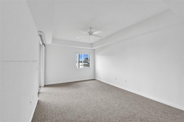 7715 Southampton Ter Unit 110, Tamarac, FL 33321 - carpeted spare room with a ceiling fan, baseboards, and a raised ceiling
