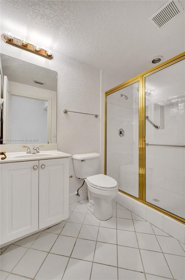 7715 Southampton Ter Unit 110, Tamarac, FL 33321 - full bath featuring visible vents, vanity, toilet, a textured ceiling, and a shower stall