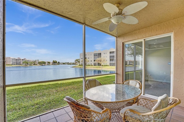 7715 Southampton Ter Unit 110, Tamarac, FL 33321 - sunroom / solarium with a water view, ceiling fan, and outdoor dining space