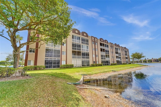 7715 Southampton Ter Unit 110, Tamarac, FL 33321 - view of building exterior with a water view