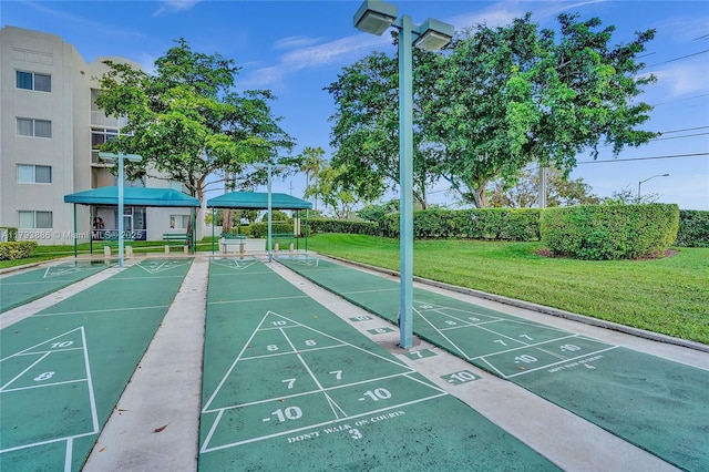 7715 Southampton Ter Unit 110, Tamarac, FL 33321 - view of community featuring a yard and shuffleboard