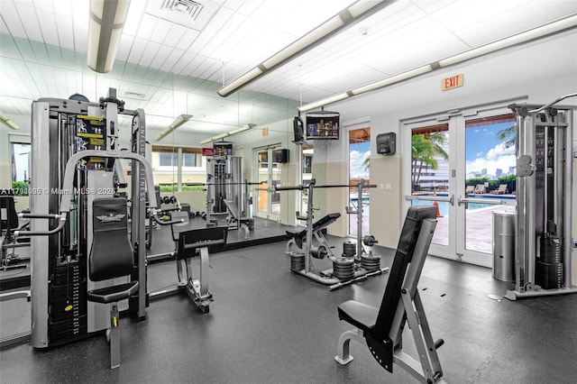 workout area with visible vents, french doors, and a wealth of natural light