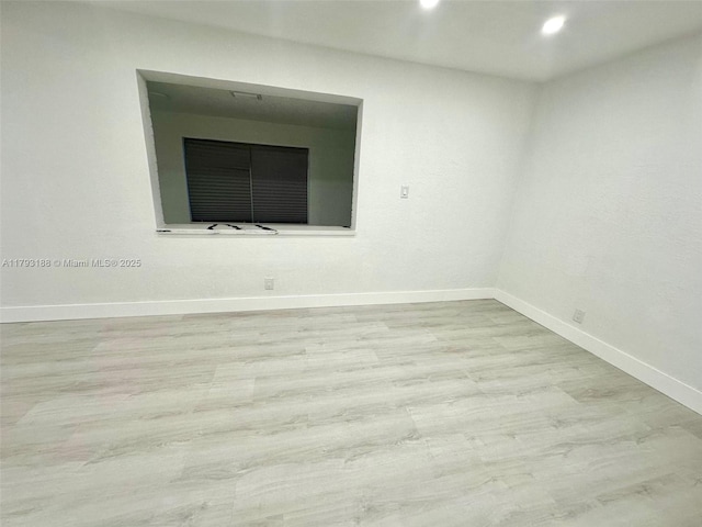 145 NW 2nd St, Dania Beach, FL 33004 - unfurnished room featuring baseboards, recessed lighting, and wood finished floors