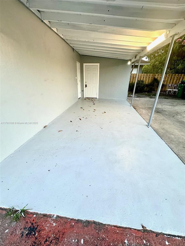 145 NW 2nd St, Dania Beach, FL 33004 - view of patio / terrace with fence and a carport