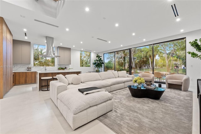 living room with recessed lighting and visible vents