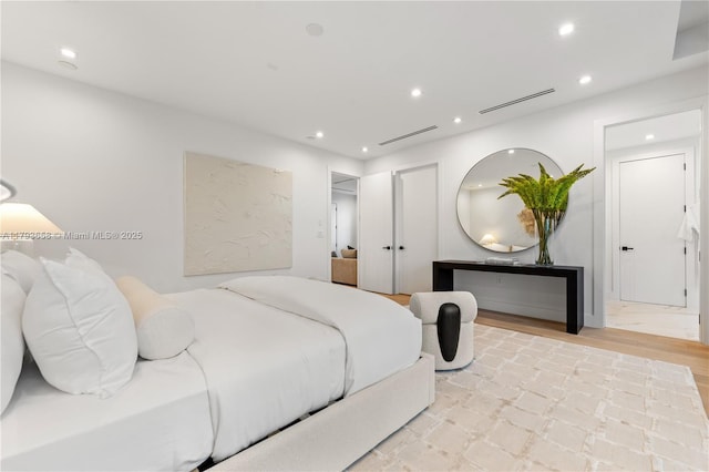 bedroom with recessed lighting and visible vents