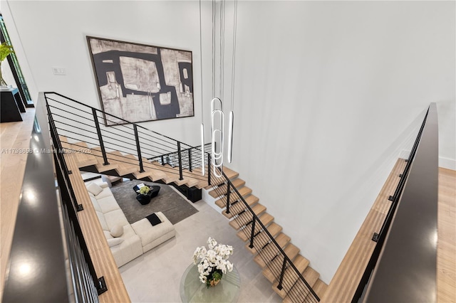 stairs featuring wood finished floors