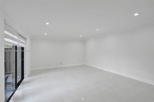 empty room featuring crown molding, recessed lighting, and baseboards