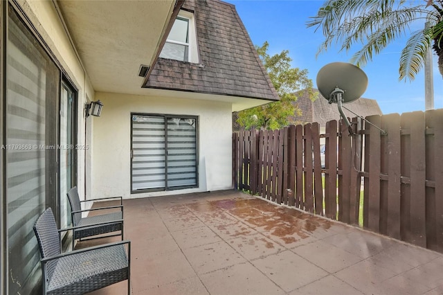 view of patio / terrace featuring fence