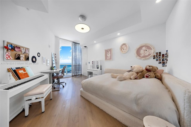 16001 Collins Ave Unit 707, Sunny Isles Beach, FL 33160 - bedroom featuring expansive windows, access to outside, wood finished floors, and recessed lighting