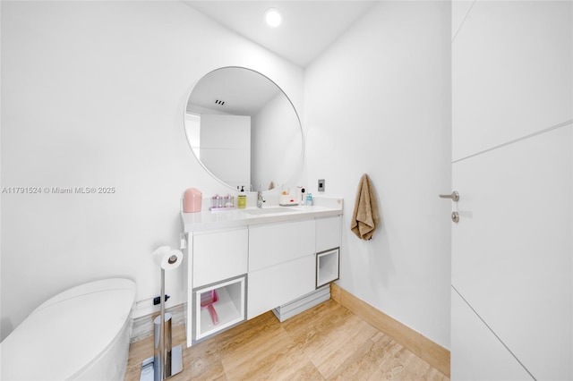 16001 Collins Ave Unit 707, Sunny Isles Beach, FL 33160 - bathroom with toilet, vanity, and baseboards