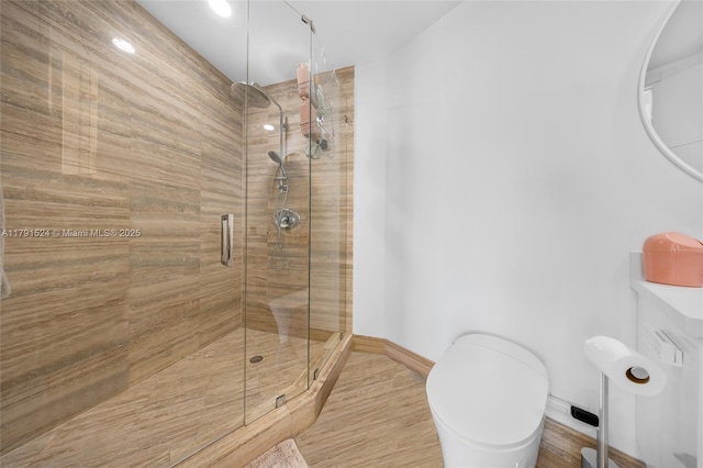 16001 Collins Ave Unit 707, Sunny Isles Beach, FL 33160 - full bathroom with a stall shower, baseboards, and toilet