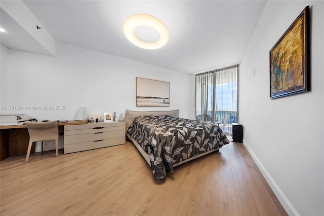 16001 Collins Ave Unit 707, Sunny Isles Beach, FL 33160 - bedroom with wood finished floors, baseboards, and a desk