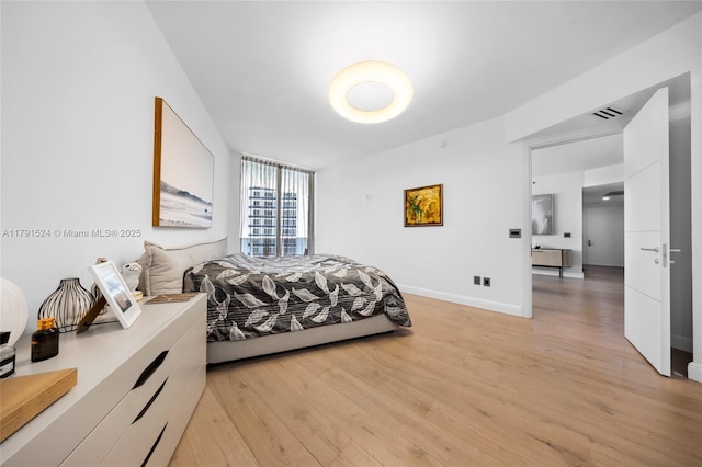 16001 Collins Ave Unit 707, Sunny Isles Beach, FL 33160 - bedroom with light wood-type flooring and baseboards