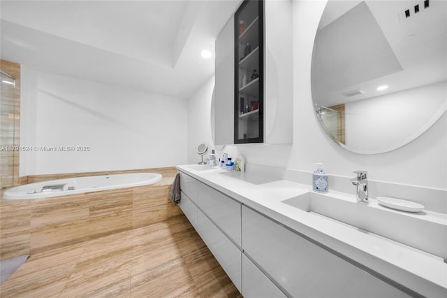 16001 Collins Ave Unit 707, Sunny Isles Beach, FL 33160 - bathroom with recessed lighting, a bath, double vanity, and an enclosed shower