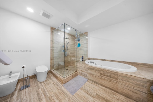 16001 Collins Ave Unit 707, Sunny Isles Beach, FL 33160 - bathroom featuring a stall shower, toilet, a bath, recessed lighting, and a bidet