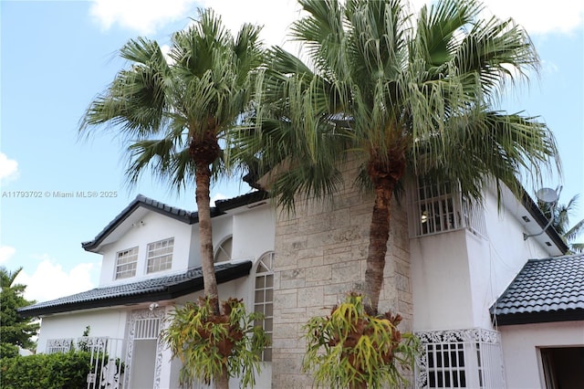 2921 SW 141st Ct, Miami, FL 33175 - view of side of property with stucco siding and a tiled roof