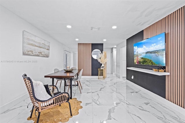 interior space with baseboards, recessed lighting, marble finish floor, and visible vents