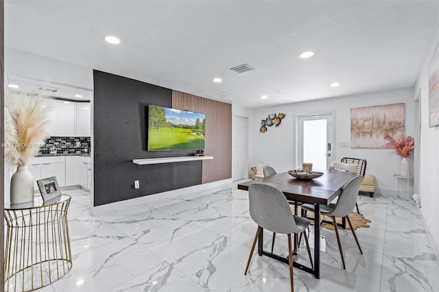dining space featuring visible vents, recessed lighting, and marble finish floor