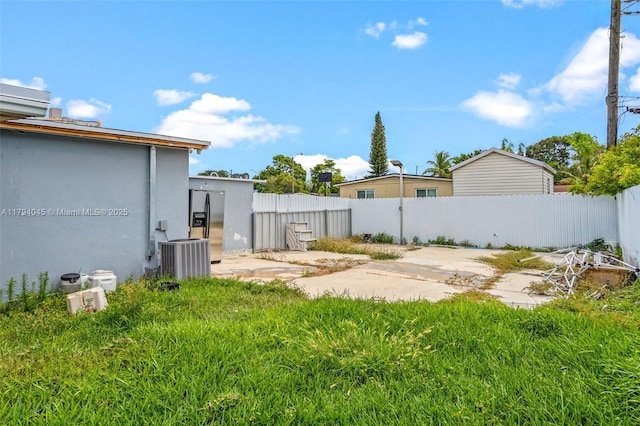 view of yard featuring a fenced backyard and cooling unit
