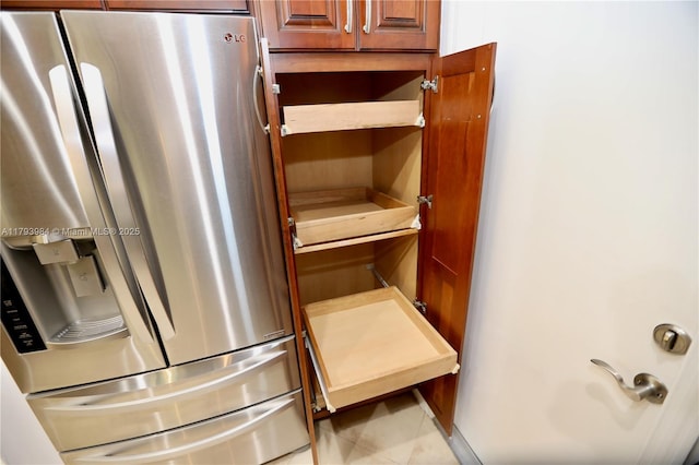 1583 Presidio Dr, Weston, FL 33327 - detailed view of stainless steel refrigerator with ice dispenser and open shelves