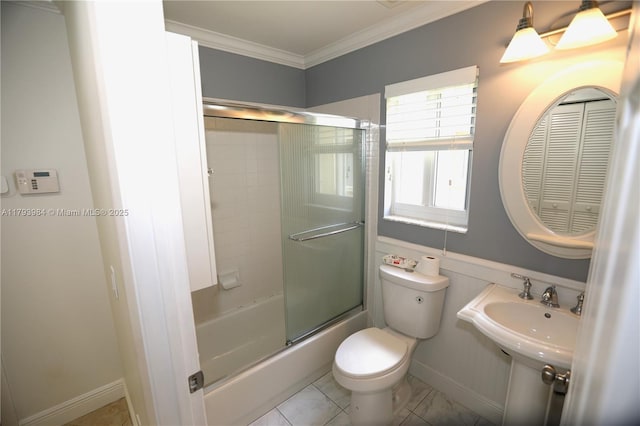 1583 Presidio Dr, Weston, FL 33327 - bathroom with ornamental molding, toilet, bath / shower combo with glass door, and baseboards