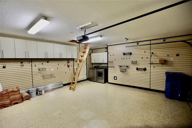 1583 Presidio Dr, Weston, FL 33327 - garage with washer / dryer and a garage door opener
