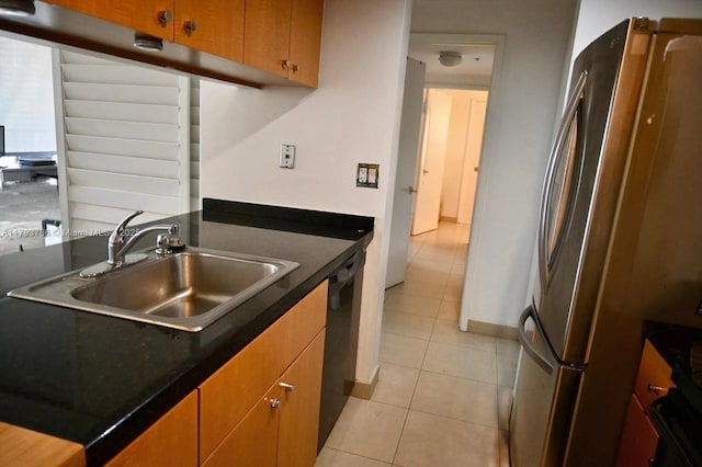 1581 Brickell Ave Unit 1807, Miami, FL 33129 - kitchen featuring a sink, dark countertops, freestanding refrigerator, and light tile patterned flooring