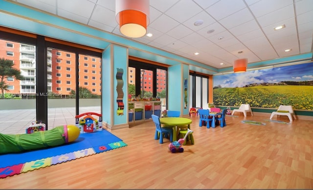1581 Brickell Ave Unit 1807, Miami, FL 33129 - game room with a paneled ceiling, recessed lighting, and wood finished floors