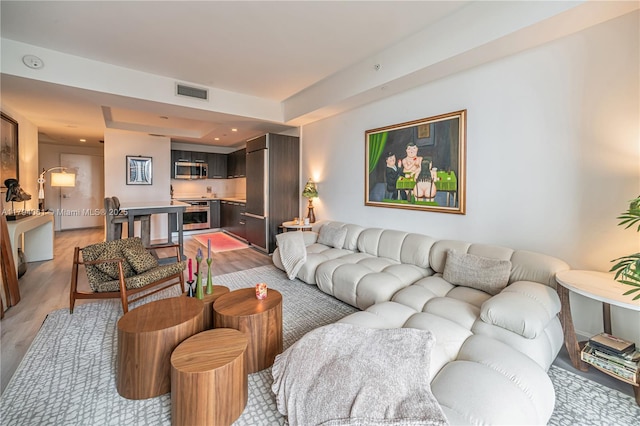 45 SW 9th St Unit 1204, Miami, FL 33130 - living room with visible vents and light wood-style floors