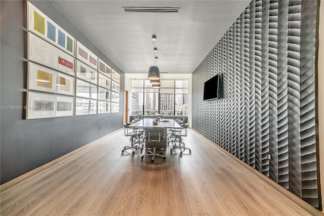 45 SW 9th St Unit 1204, Miami, FL 33130 - dining area featuring baseboards, wood finished floors, and visible vents