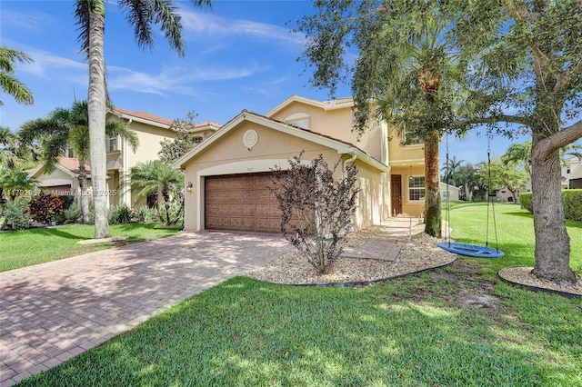 7643 Corkwood Ave, Boynton Beach, FL 33437 - view of front facade featuring an attached garage, stucco siding, driveway, and a front yard