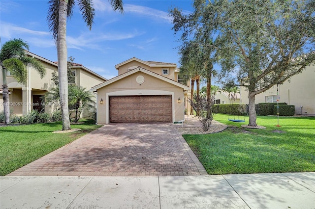 7643 Corkwood Ave, Boynton Beach, FL 33437 - mediterranean / spanish-style home with decorative driveway, a front yard, stucco siding, and a garage