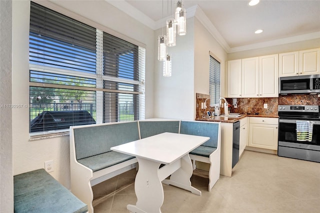 7643 Corkwood Ave, Boynton Beach, FL 33437 - kitchen featuring appliances with stainless steel finishes, a sink, ornamental molding, breakfast area, and backsplash