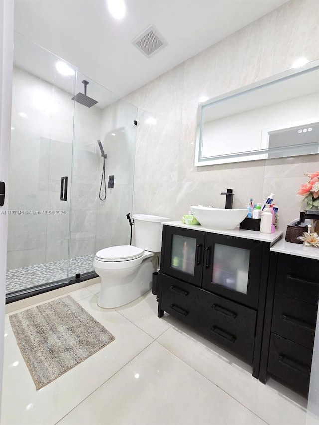 11015 SW 158th Ter, Miami, FL 33157 - full bath with vanity, toilet, tile walls, a shower stall, and visible vents