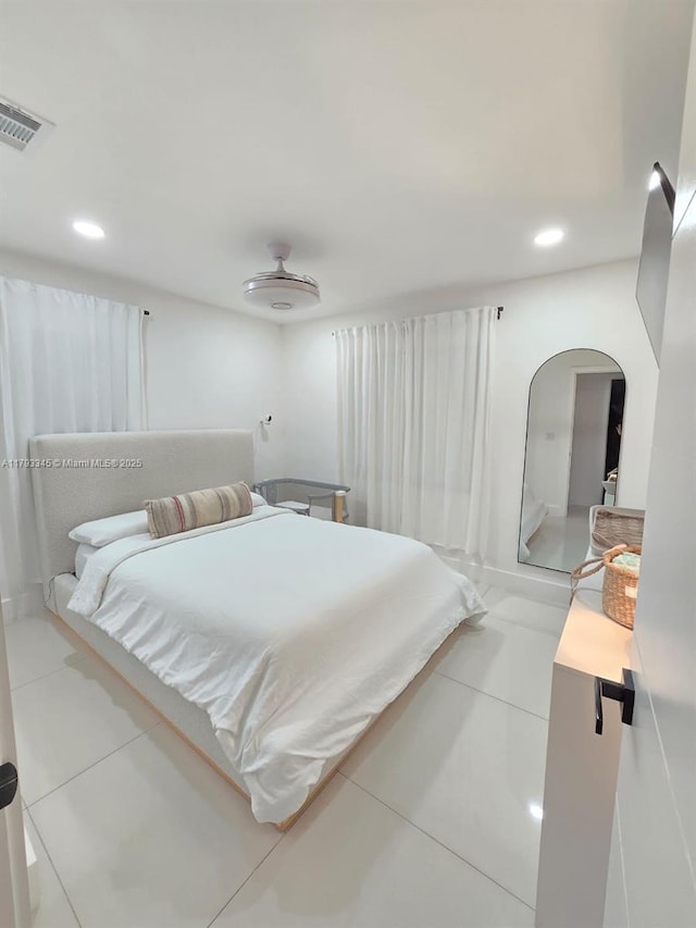 11015 SW 158th Ter, Miami, FL 33157 - tiled bedroom featuring arched walkways, visible vents, and recessed lighting