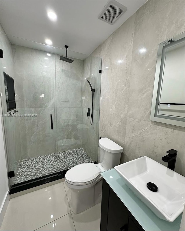 11015 SW 158th Ter, Miami, FL 33157 - bathroom with visible vents, tile walls, a stall shower, vanity, and toilet