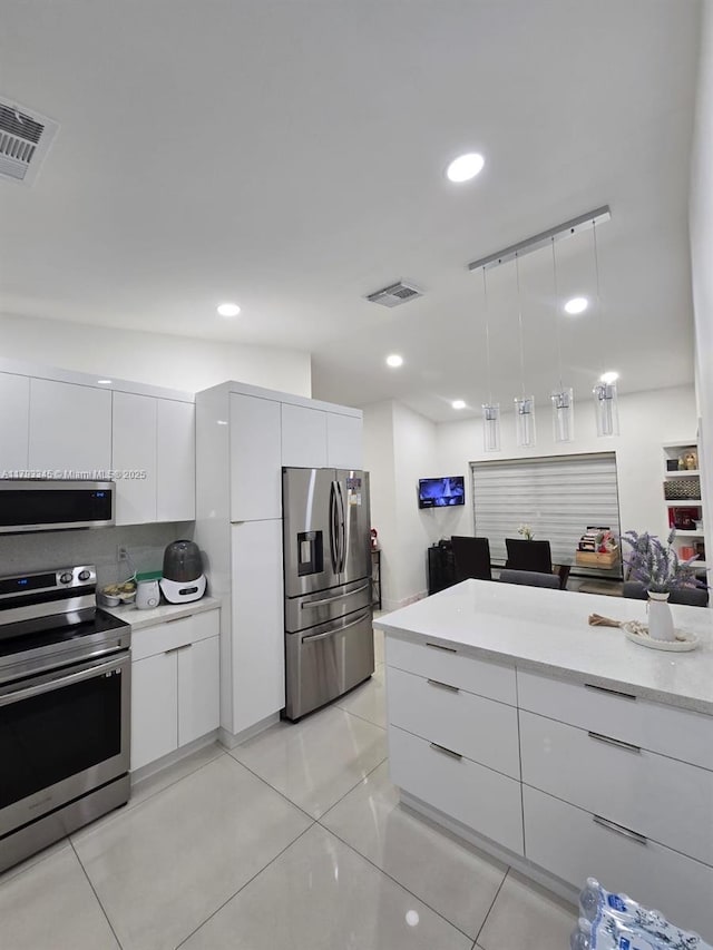 11015 SW 158th Ter, Miami, FL 33157 - kitchen with modern cabinets, white cabinets, and stainless steel appliances