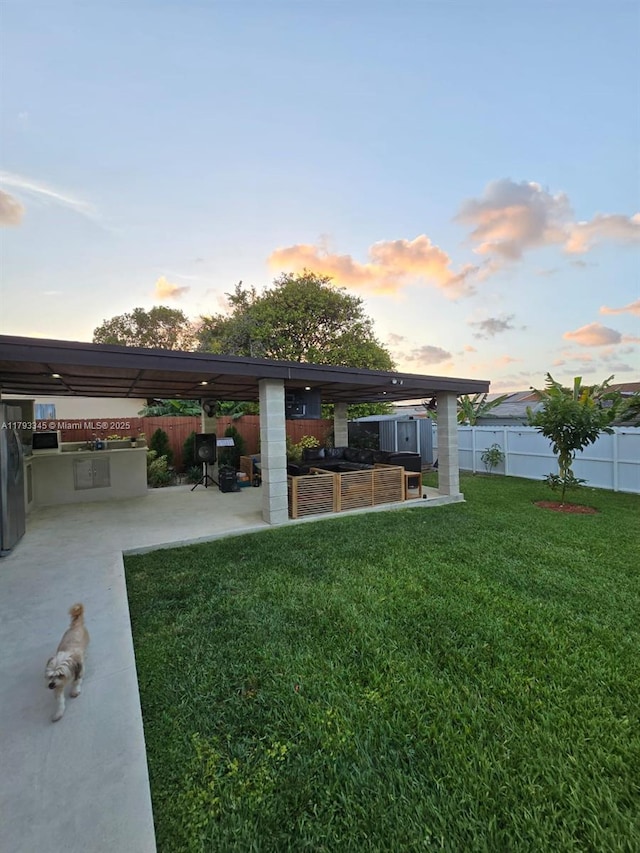 11015 SW 158th Ter, Miami, FL 33157 - view of yard featuring a fenced backyard, a patio, and exterior kitchen