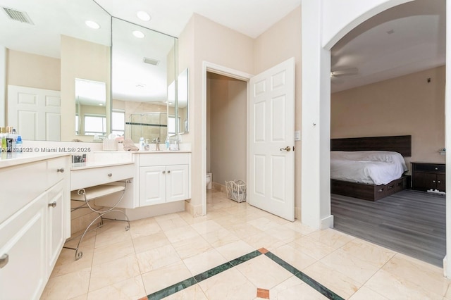 999 N Harbor Vw N, Hollywood, FL 33019 - ensuite bathroom with vanity, a ceiling fan, recessed lighting, a shower stall, and visible vents