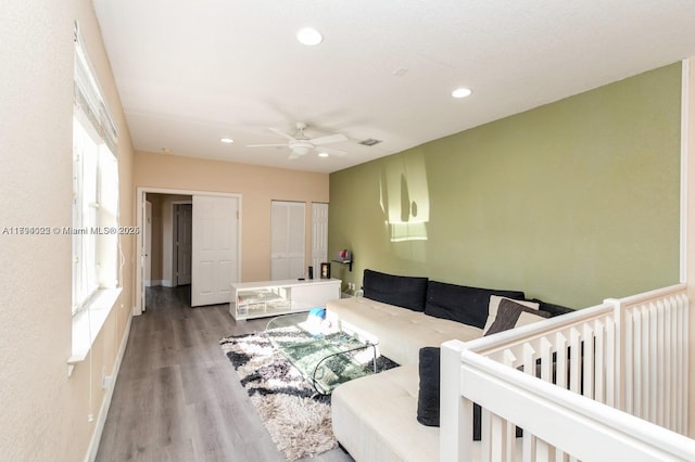 999 N Harbor Vw N, Hollywood, FL 33019 - living room featuring a ceiling fan, recessed lighting, plenty of natural light, and wood finished floors