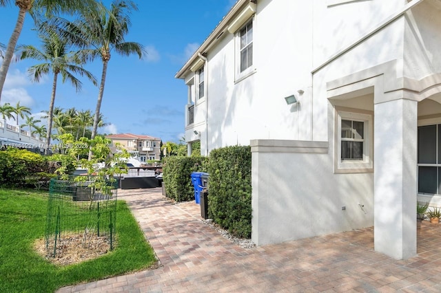 999 N Harbor Vw N, Hollywood, FL 33019 - view of home's exterior featuring a patio and stucco siding