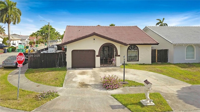 14391 SW 24th St, Miami, FL 33175 - mediterranean / spanish home with a garage, a front lawn, stucco siding, concrete driveway, and a tile roof
