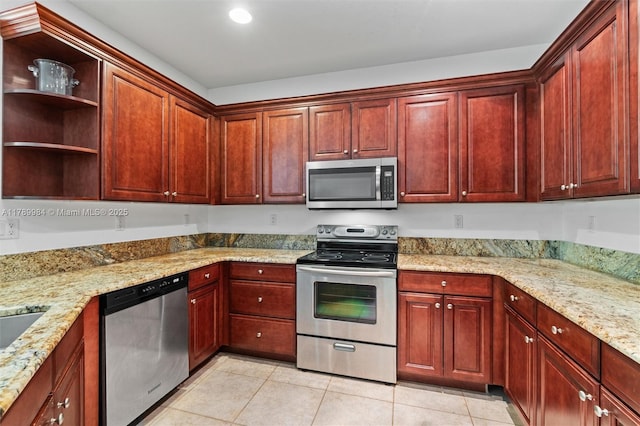 kitchen featuring reddish brown cabinets, open shelves, appliances with stainless steel finishes, and light tile patterned flooring