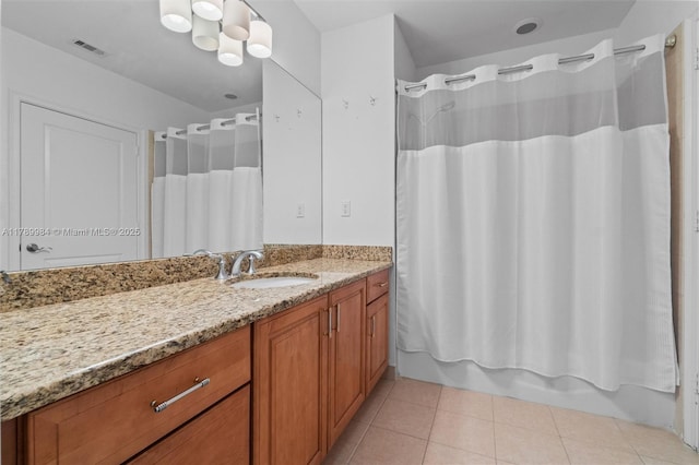bathroom with tile patterned floors, visible vents, shower / bath combo, and vanity