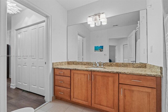 2924 Hidden Harbour Ct, Dania Beach, FL 33312 - bathroom with vanity, a closet, and a chandelier